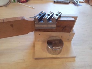 A jig used to drill the holes for the tuning machines in the headstock.