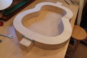 Building the mold that the classical guitar is built in.