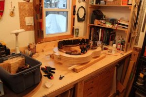 Gluing on the kerfing, the ledge that the top and back are glued to. 